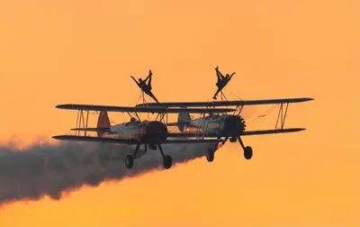 an airplane flying in the sky with smoke at No27 Ayr Beach - Coorie Doon Stays in Ayr