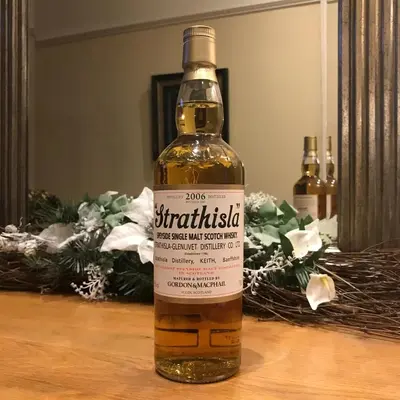a bottle of whisky sitting on a table at Ashtree House Hotel, Glasgow Airport & Paisley in Paisley