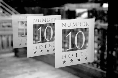 two signs that say number and hotel at Number 10 Hotel in Glasgow