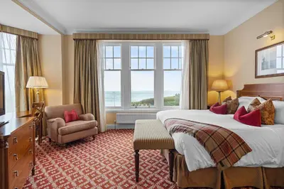a hotel room with a large bed and a window at The Ugadale Hotel in Campbeltown