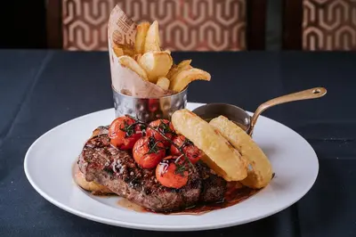 a plate of food with a steak and french fries at The Ugadale Hotel in Campbeltown