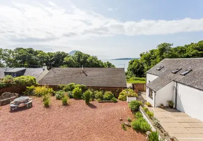 an aerial view of a backyard with two houses at Oakbank Farm in Lamlash