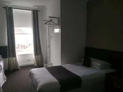 a hotel room with a bed and a window at The Park Hotel in Dunoon