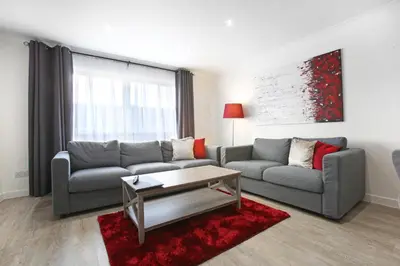 a living room with a couch and a coffee table at Vkm Apartments in Glasgow