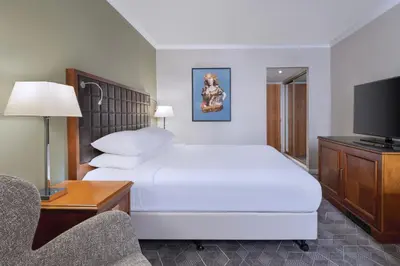 a hotel room with a large bed and a tv at Delta Hotels by Marriott Edinburgh in Edinburgh