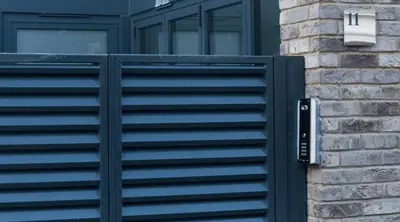 a black gate on the side of a house at Gillespie House in Edinburgh