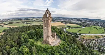 an aerial view of a tower on top of a castle at Wallace View Apartment in Stirling