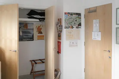 a door in a room with a map on the wall at BroomHouse HomeStay in Edinburgh