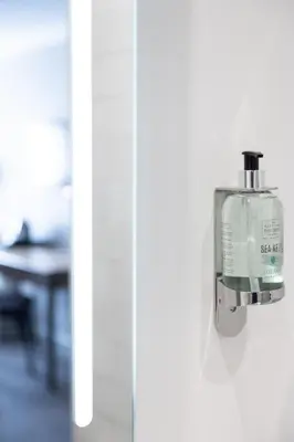 a soap dispenser is hanging on a wall at Toby Carvery Strathclyde, M74 J6 by Innkeeper's Collection in Motherwell