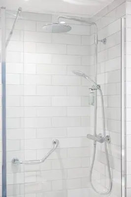 a shower with a glass door in a bathroom at Toby Carvery Strathclyde, M74 J6 by Innkeeper's Collection in Motherwell