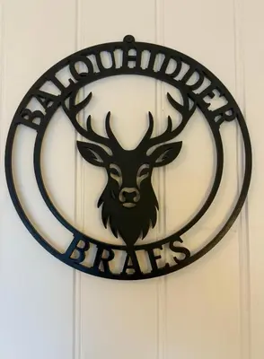 a sign for the detroit tigers hanging on a wall at Balquhidder Braes Holiday Park Lodges, mostly with Hot Tubs and pet friendly, EV facilities in Lochearnhead