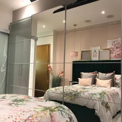 a bedroom with two beds and a glass wall at 2 bed Chic Apartment in Glasgow City Centre in Glasgow