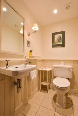 a bathroom with a toilet and a sink at Barcaldine Castle in Oban