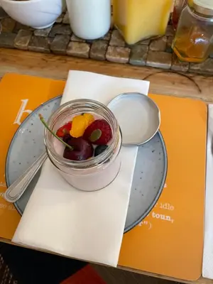a bowl of fruit on a plate on a table at Gowanlea Guest House in Balloch