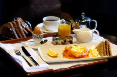 a table with a plate of breakfast food on a tray at Best Western Garfield House Hotel in Chryston
