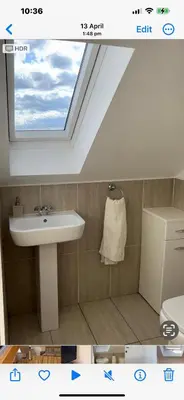 a bathroom with a sink and a skylight at West Highland Way Rooms ED30002F in Milngavie