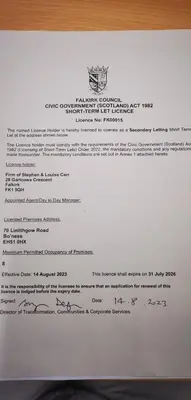 a piece of paper with a letter on it at Newtown Apartments in Boʼness
