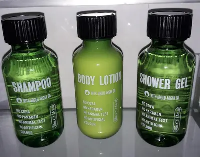 two bottles of baby lotion on a shelf at The Four Seasons Hotel in Saint Fillans