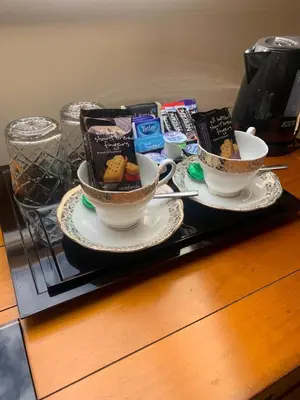 a tray with two cups of tea and cookies at Inverasdale in Oban