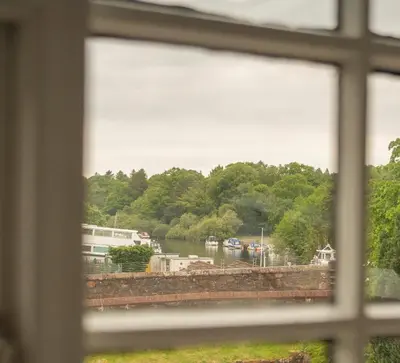 a view of a river from a window at Forty Winks Loch Lomond in Balloch