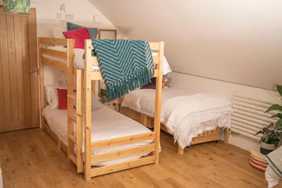 a bunk bed room with two bunk beds at Forty Winks Loch Lomond in Balloch