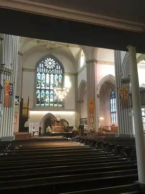 a large church with pews and a large window at Brucefield Avenue, Dunfermline in Dunfermline