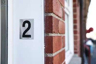 a number sign on a brick building at Netherton House in Wishaw