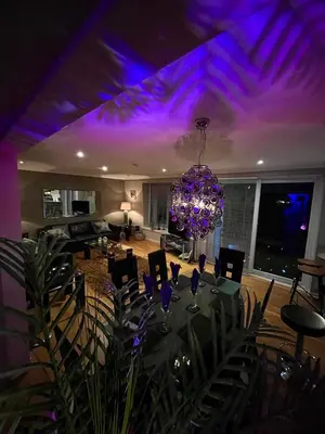 a dining room with a table and a purple ceiling at Gleneagles Lettings in Auchterarder