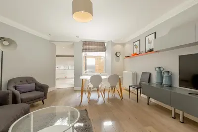 a living room with a table and chairs at Destiny Scotland - Q-Residence in Edinburgh