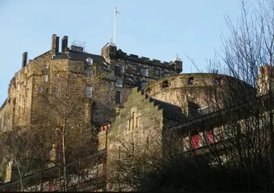 an old stone building with a building at Charming 1 Bed Apartment with Castle View in Edinburgh