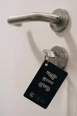 a tag is attached to a door handle at The Ranald Hotel in Oban