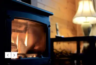 a oven with a fire inside of it at Caol Gleann Lodge in Rowardennan