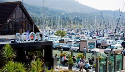 a bunch of cars parked in a parking lot at Largs stay With Private parking in Largs