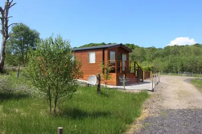 a small cabin in the middle of a field at Mountain View in Taynuilt