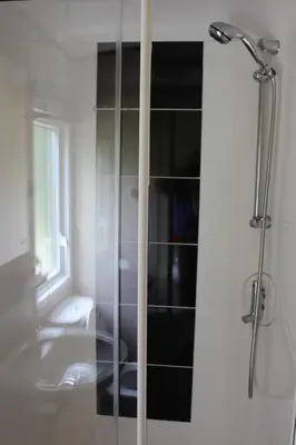 a bathroom with a shower with a sink and a toilet at Glen View in Taynuilt