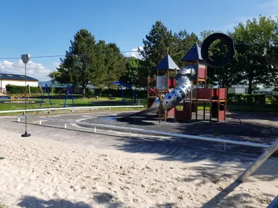 a playground in a park with a slide at The Swan Inn in Stranraer