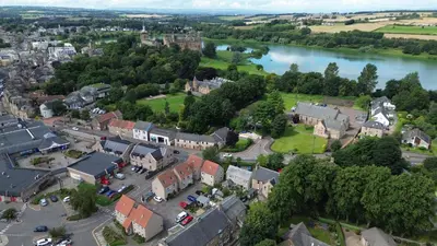 an aerial view of a town next to a river at Central Apartment Linlithgow in Linlithgow