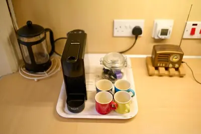 a tray with cups on a table with a blender at Panoramic Sea Views - Stunning 3BD Apt & Balcony in Oban