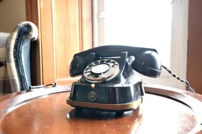 a telephone sitting on top of a sink at JOIVY Classic Apt with Castle Views in Old Town in Edinburgh