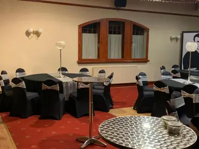 a room with tables and chairs in a room at Dunmar House Hotel - Bar & Restaurant in Alloa
