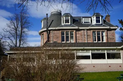a house with a chimney on top of it at The Murray Park Hotel in Crieff