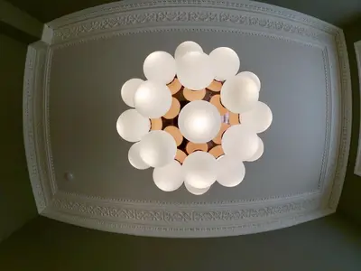 a chandelier hanging from the ceiling of a room at Escape To Edinburgh @ Albyn Place in Edinburgh