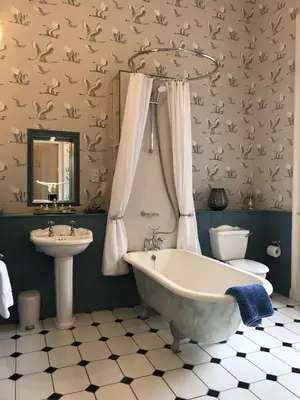 a bathroom with a tub and a sink at Escape To Edinburgh @ Albyn Place in Edinburgh