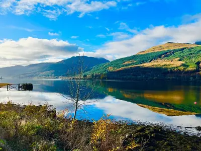 a view of a lake with mountains in the background at Rowantreebank Bed and Breakfast in Arrochar