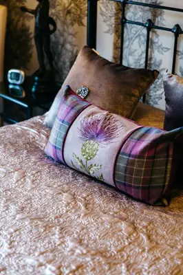 a bed with two pillows on top of it at Altavona House in Oban