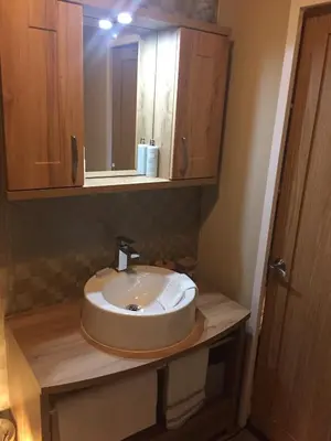 a bathroom with a sink and a mirror at Brightwater Lodge in Dunning