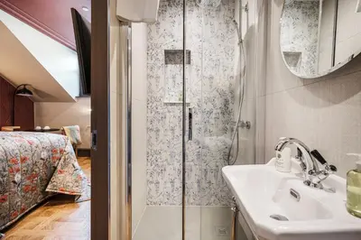 a bathroom with a shower and a sink at Bonnie Hotel - Smart Boutique ApartHotel - Haymarket Edinburgh in Edinburgh