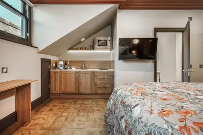 a bedroom with a bed and a sink at Bonnie Hotel - Smart Boutique ApartHotel - Haymarket Edinburgh in Edinburgh