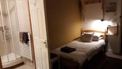 a small bedroom with a small bed in a room at Garragh Mhor in Oban