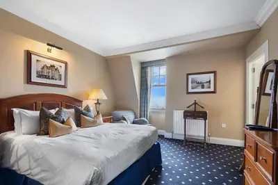 a hotel room with a bed and a window at The Royal Hotel Campbeltown in Campbeltown